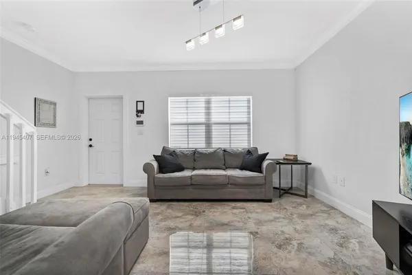 a living room with furniture and a window
