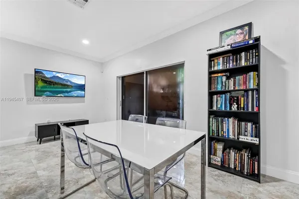 a workspace with furniture and a book shelf