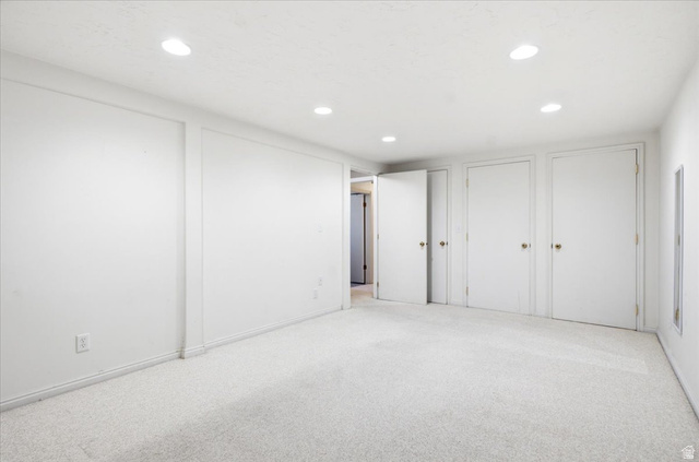 7050 South 260 East Midvale, UT 84047 - Photo 20 of 28 Room featuring light-toned carpeting, recessed ceiling lighting, and multiple white panel doors