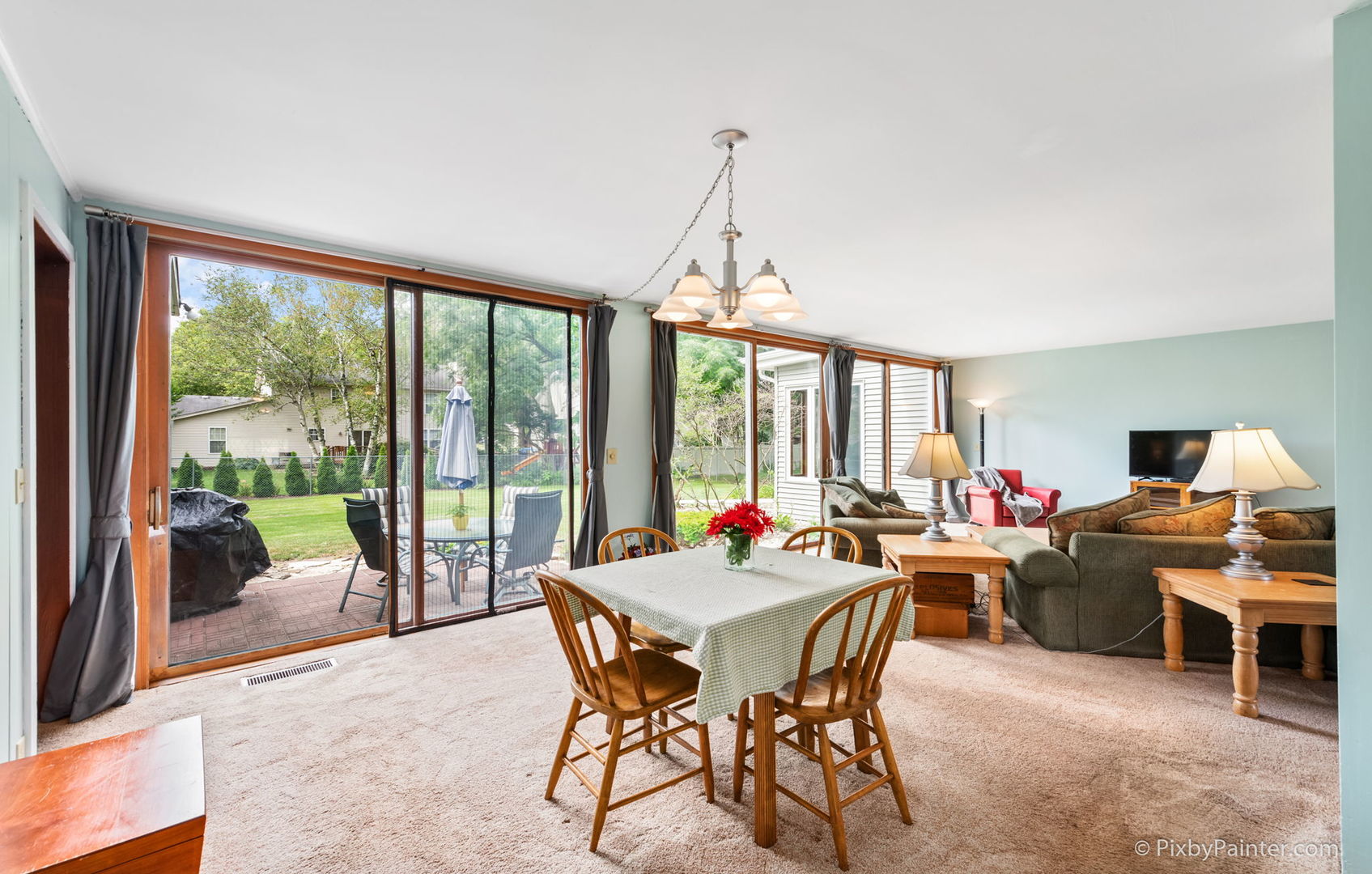 736 Carlisle Road Batavia, IL 60510 - Photo 14 of 25 a view of a dining room with furniture large windows and wooden floor