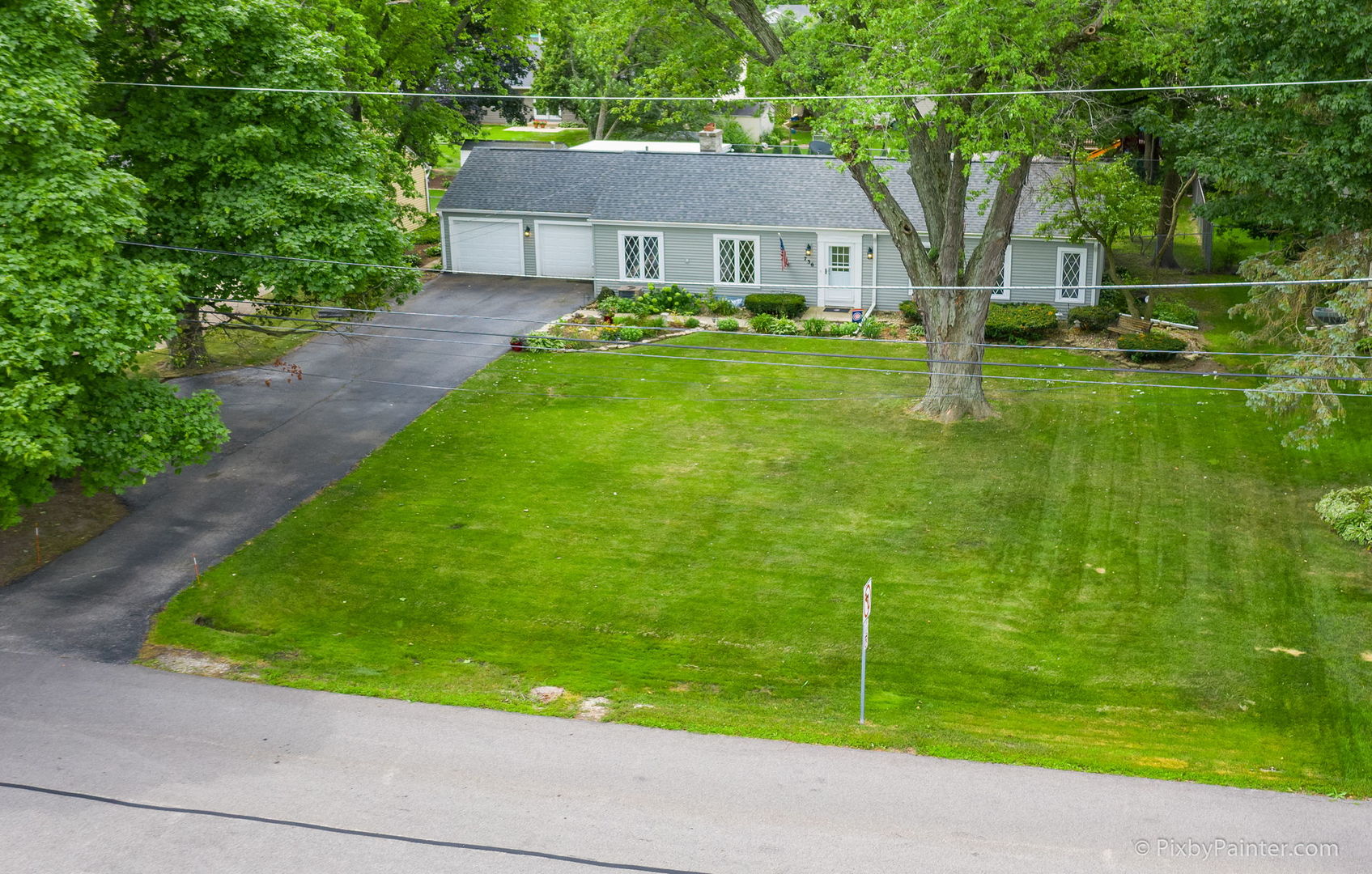 736 Carlisle Road Batavia, IL 60510 - Photo 3 of 25 a view of a house with a backyard and a tree