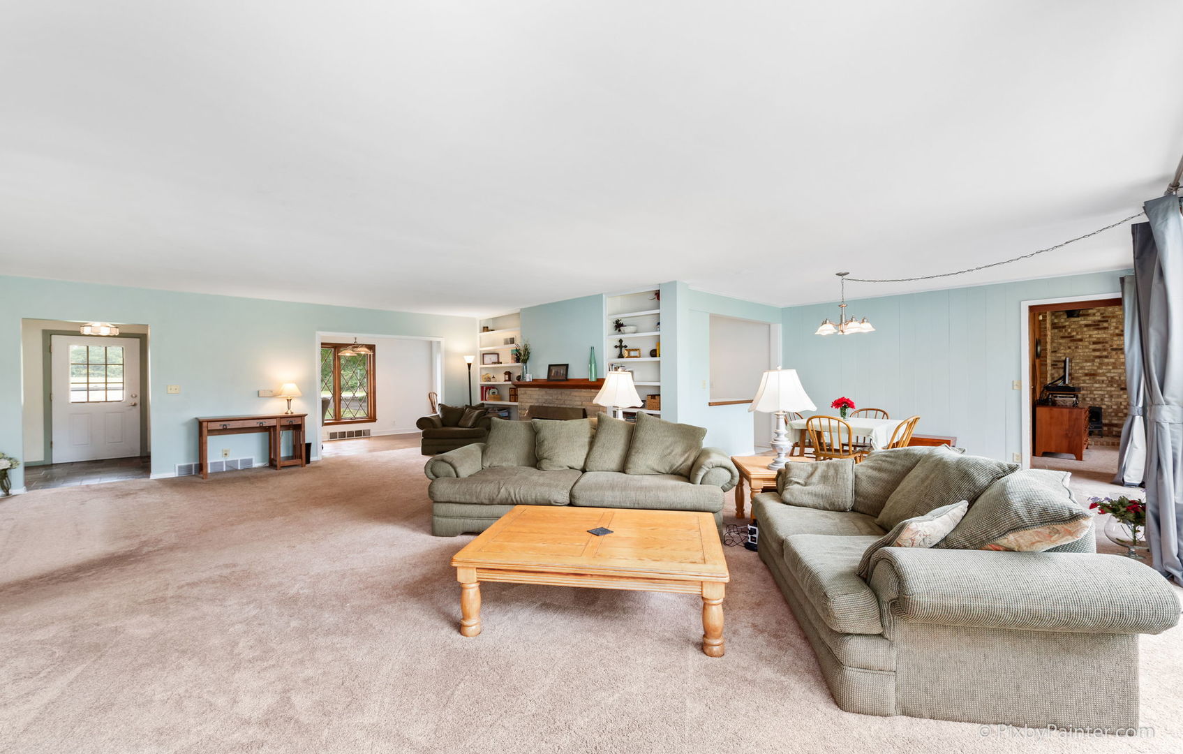 736 Carlisle Road Batavia, IL 60510 - Photo 8 of 25 a living room with furniture and a flat screen tv