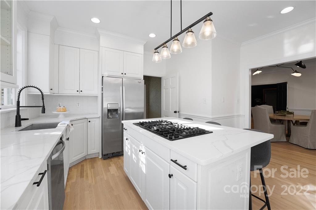 2026 South Wendover Road Charlotte, NC 28211 - Photo 6 of 31 a kitchen with a stove a sink a refrigerator and cabinets