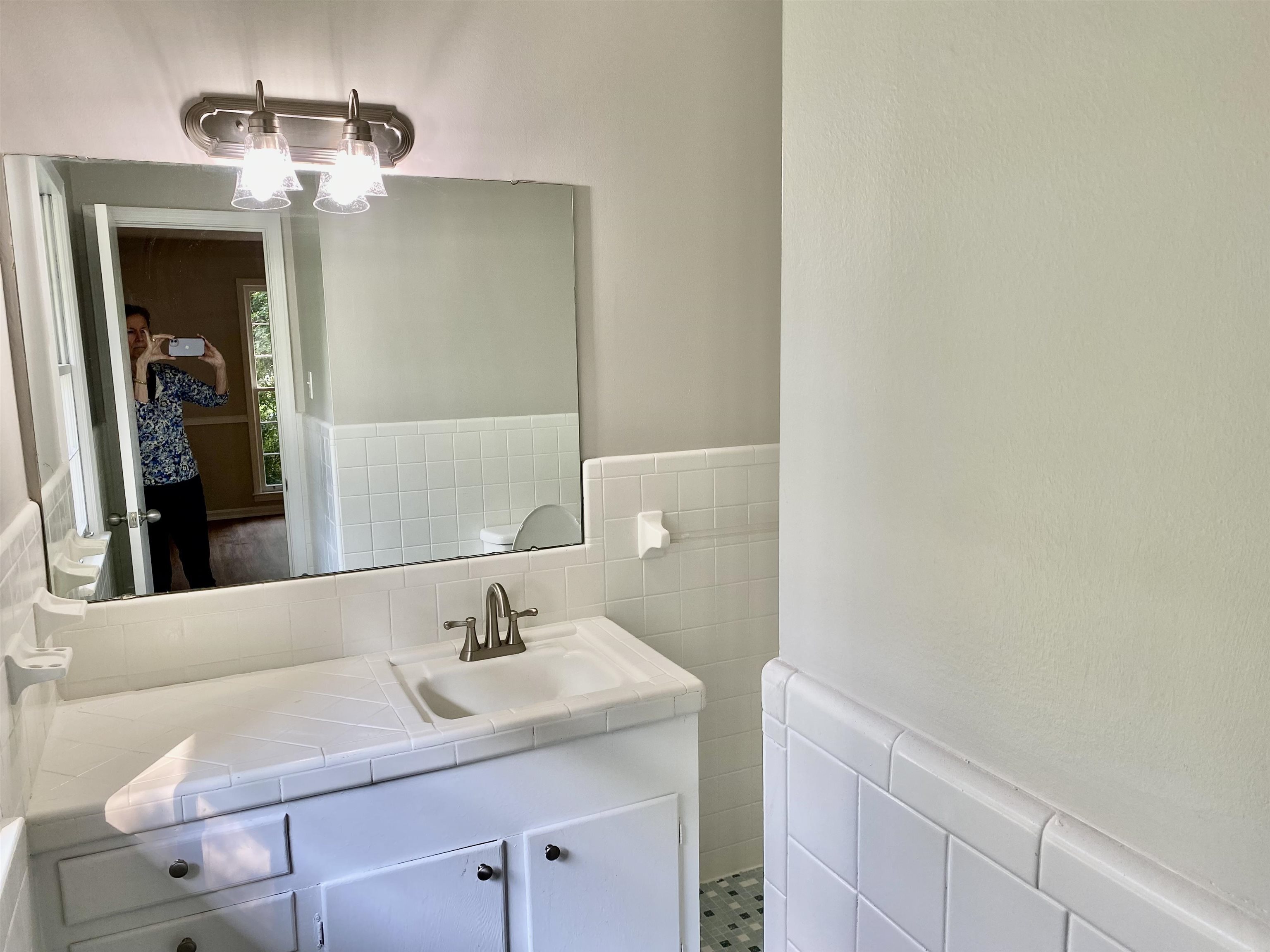 16 Jefferson Drive Rome, GA 30165 - Photo 17 of 26 a bathroom with a sink and a mirror