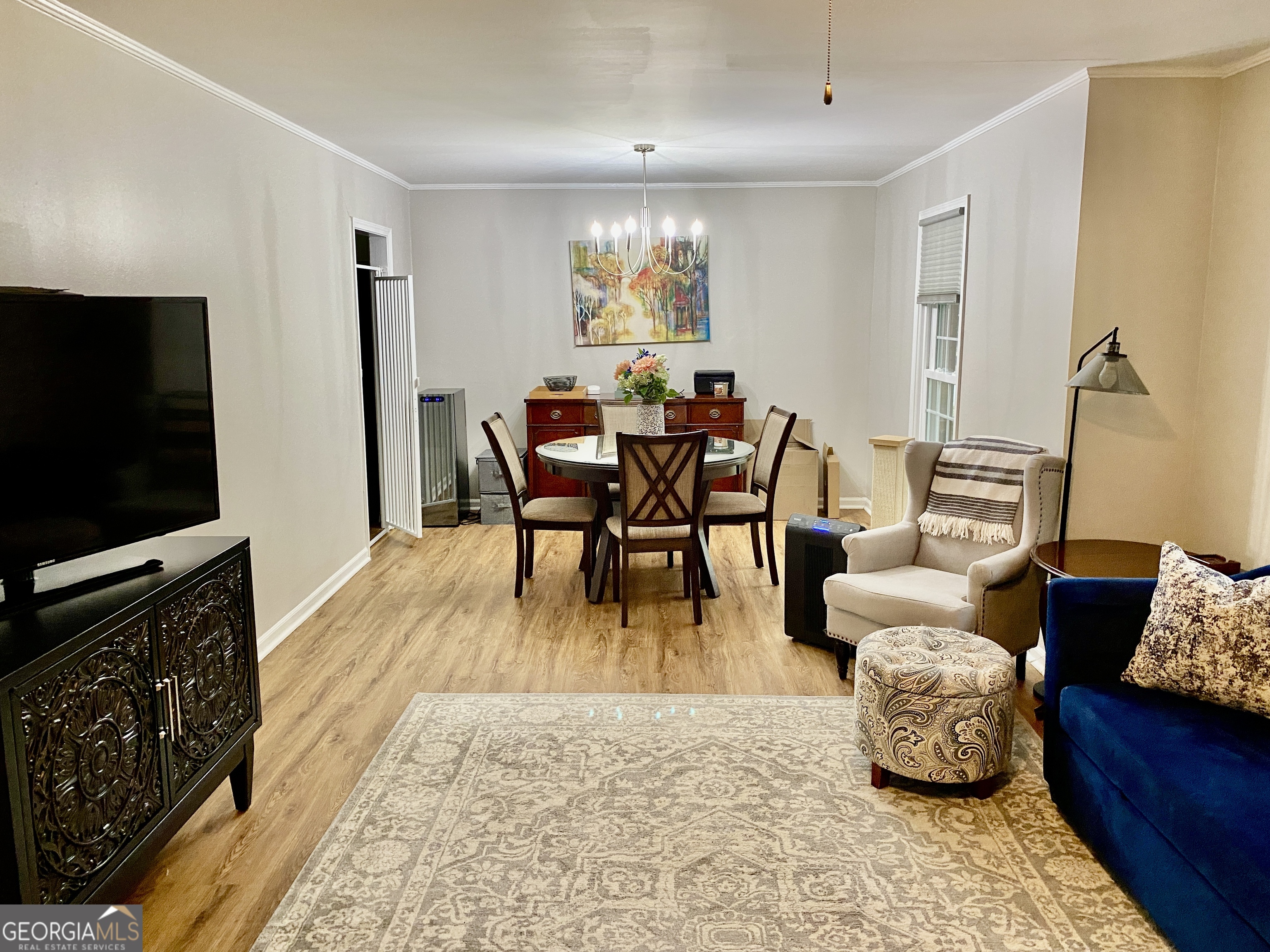 16 Jefferson Drive Rome, GA 30165 - Photo 22 of 26 a living room with furniture and a flat screen tv