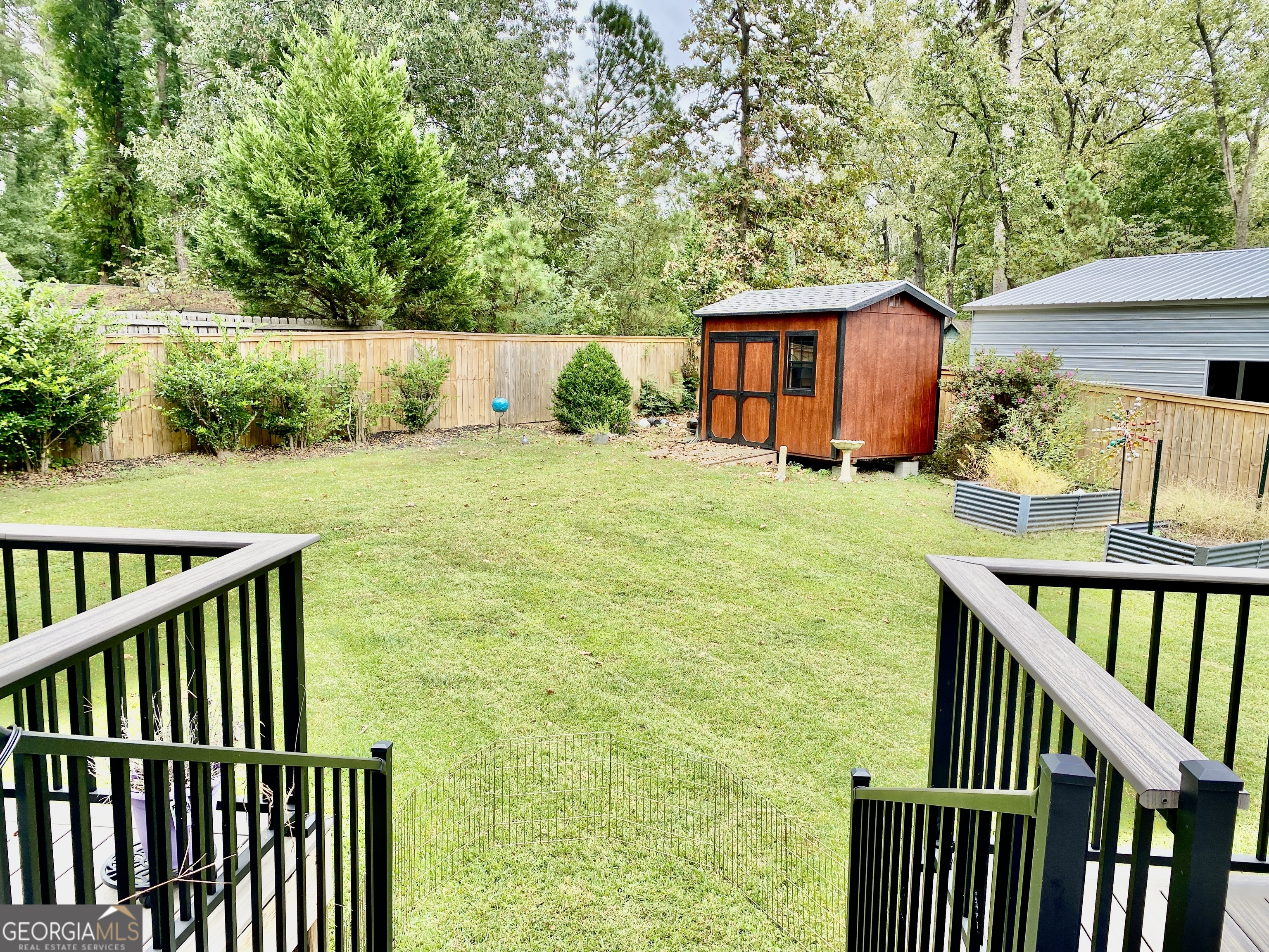 16 Jefferson Drive Rome, GA 30165 - Photo 25 of 26 a view of a backyard with wooden fence and large trees