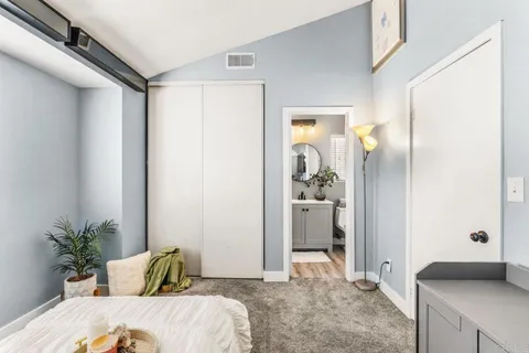 a bathroom with a toilet a sink and a mirror