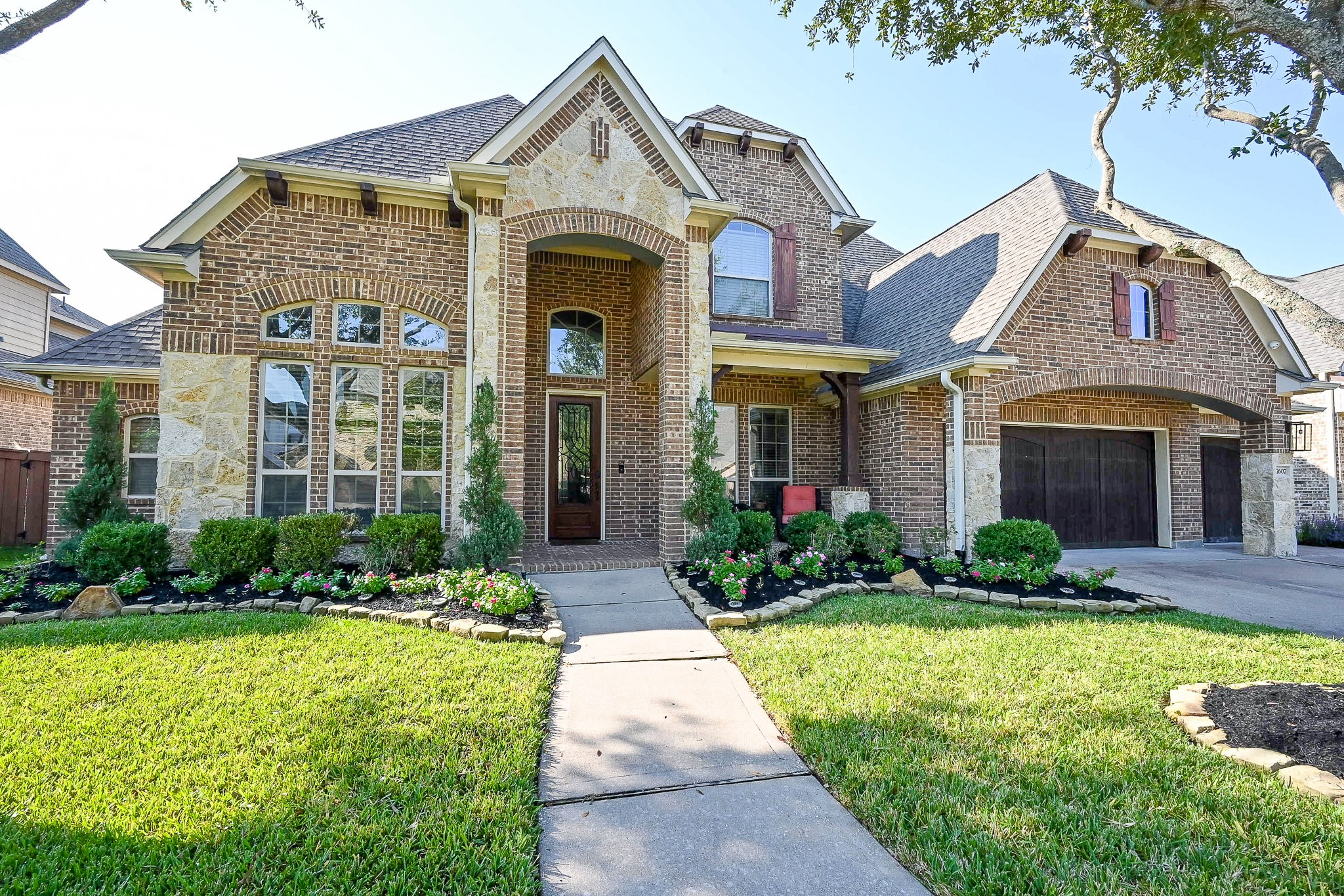 a front view of a house with garden
