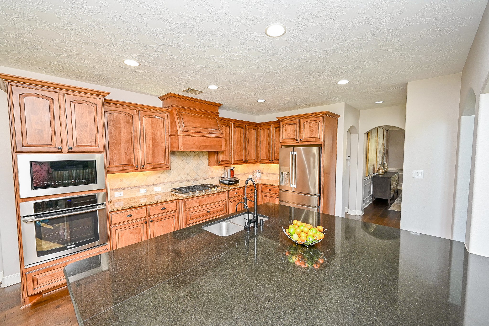 17607 Astrachan Road Richmond, TX 77407 - Photo 14 of 50 a kitchen with stainless steel appliances lots of counter top space