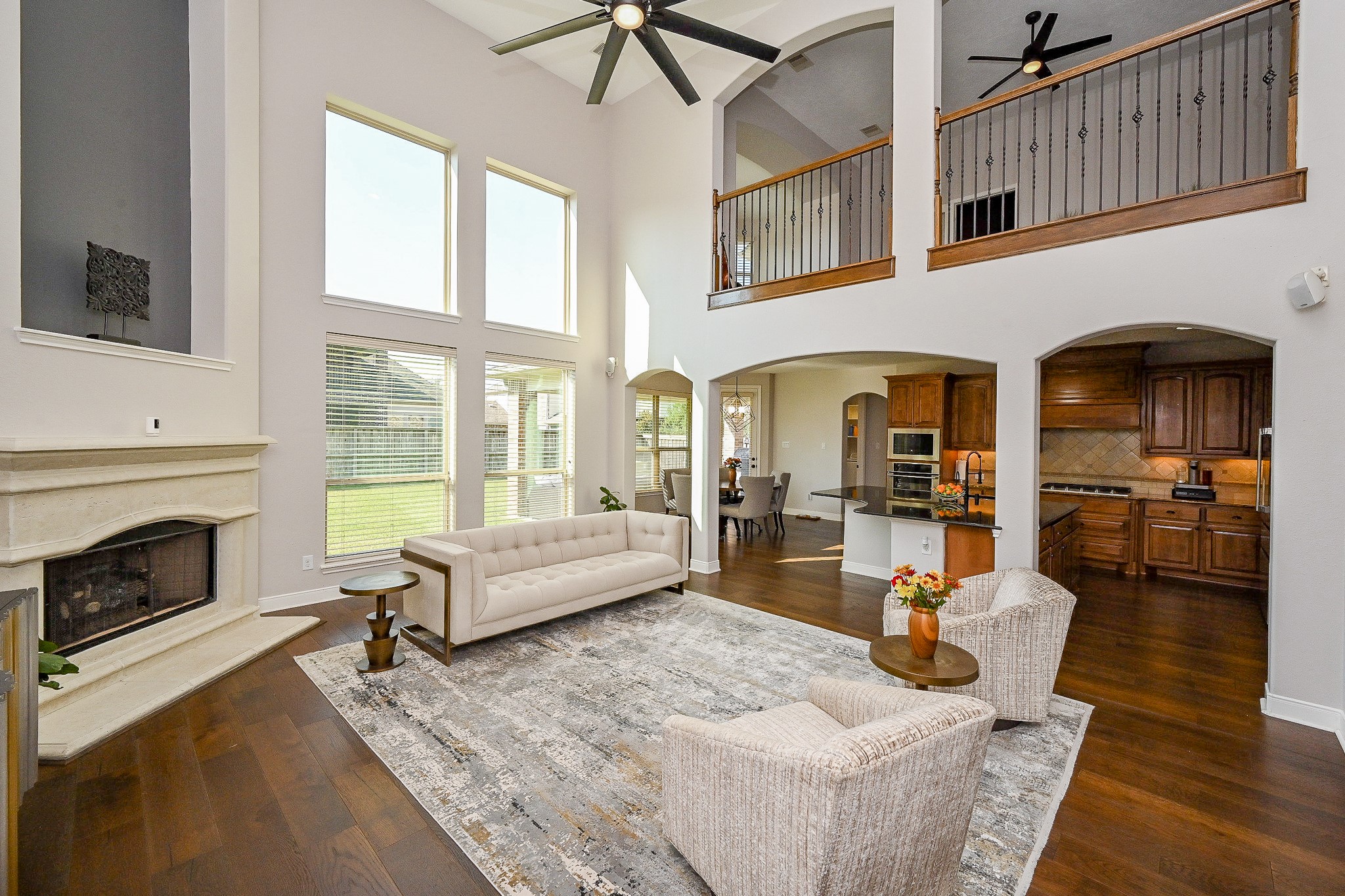 17607 Astrachan Road Richmond, TX 77407 - Photo 17 of 50 a living room with furniture a fireplace and a flat screen tv