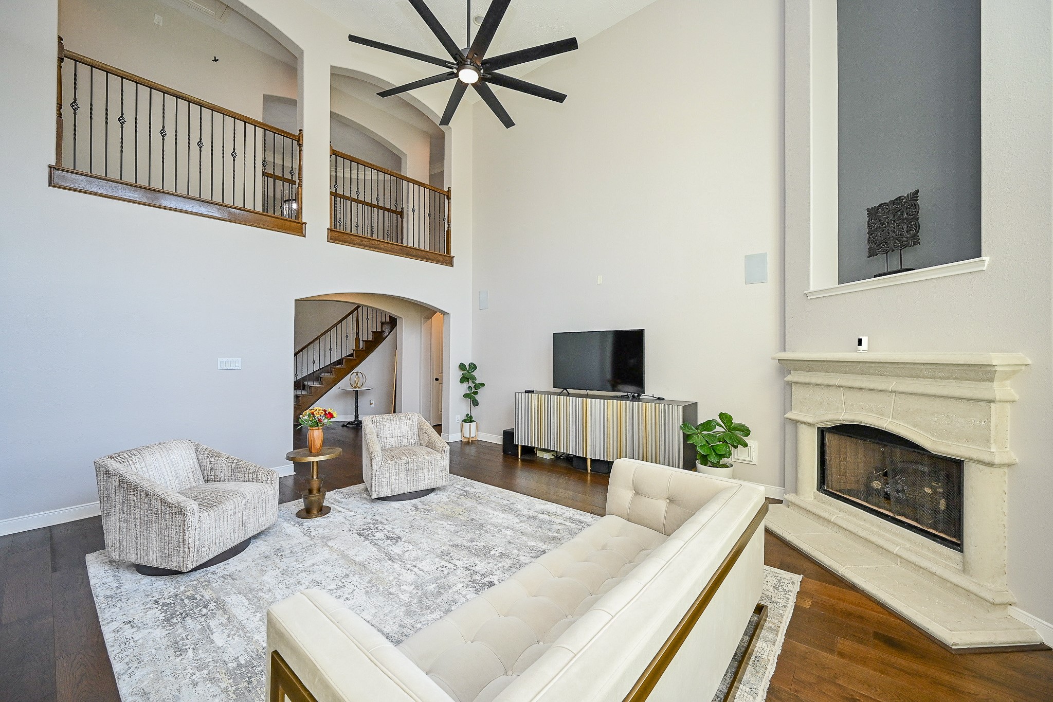 17607 Astrachan Road Richmond, TX 77407 - Photo 18 of 50 a living room with furniture and a fireplace