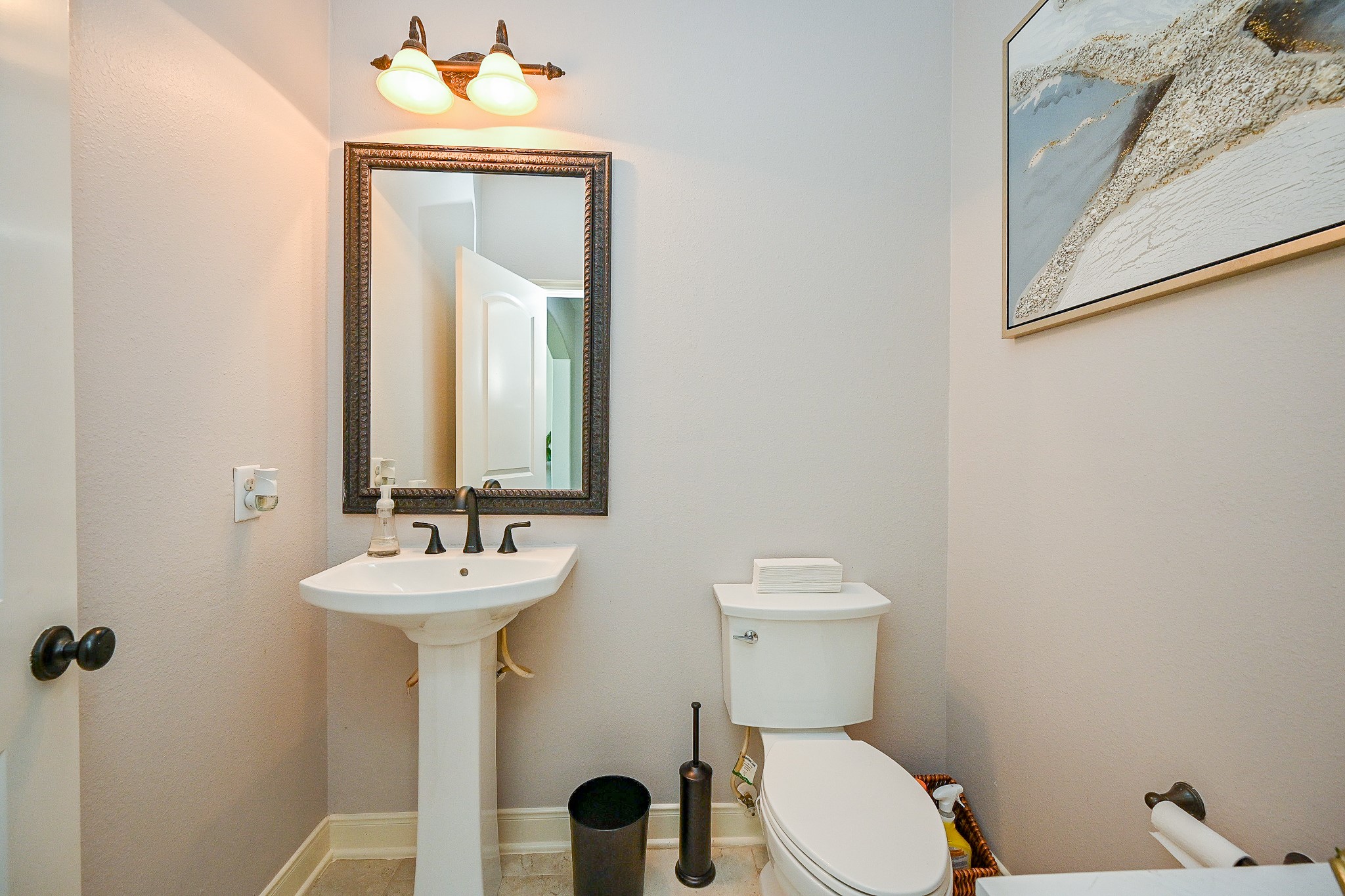 17607 Astrachan Road Richmond, TX 77407 - Photo 21 of 50 a bathroom with a sink mirror toilet and a window