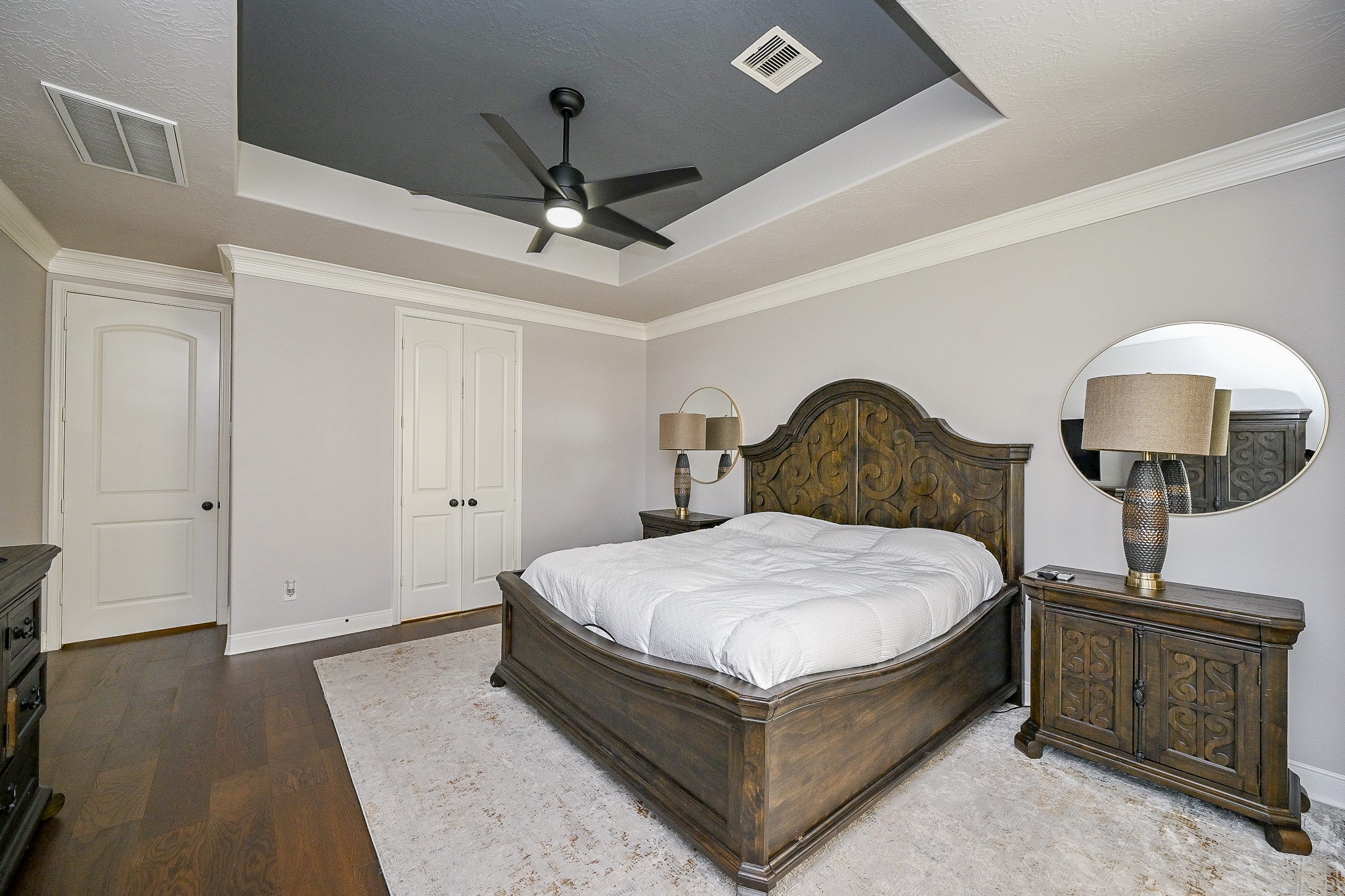 17607 Astrachan Road Richmond, TX 77407 - Photo 23 of 50 a bedroom with a bed chandelier and a window