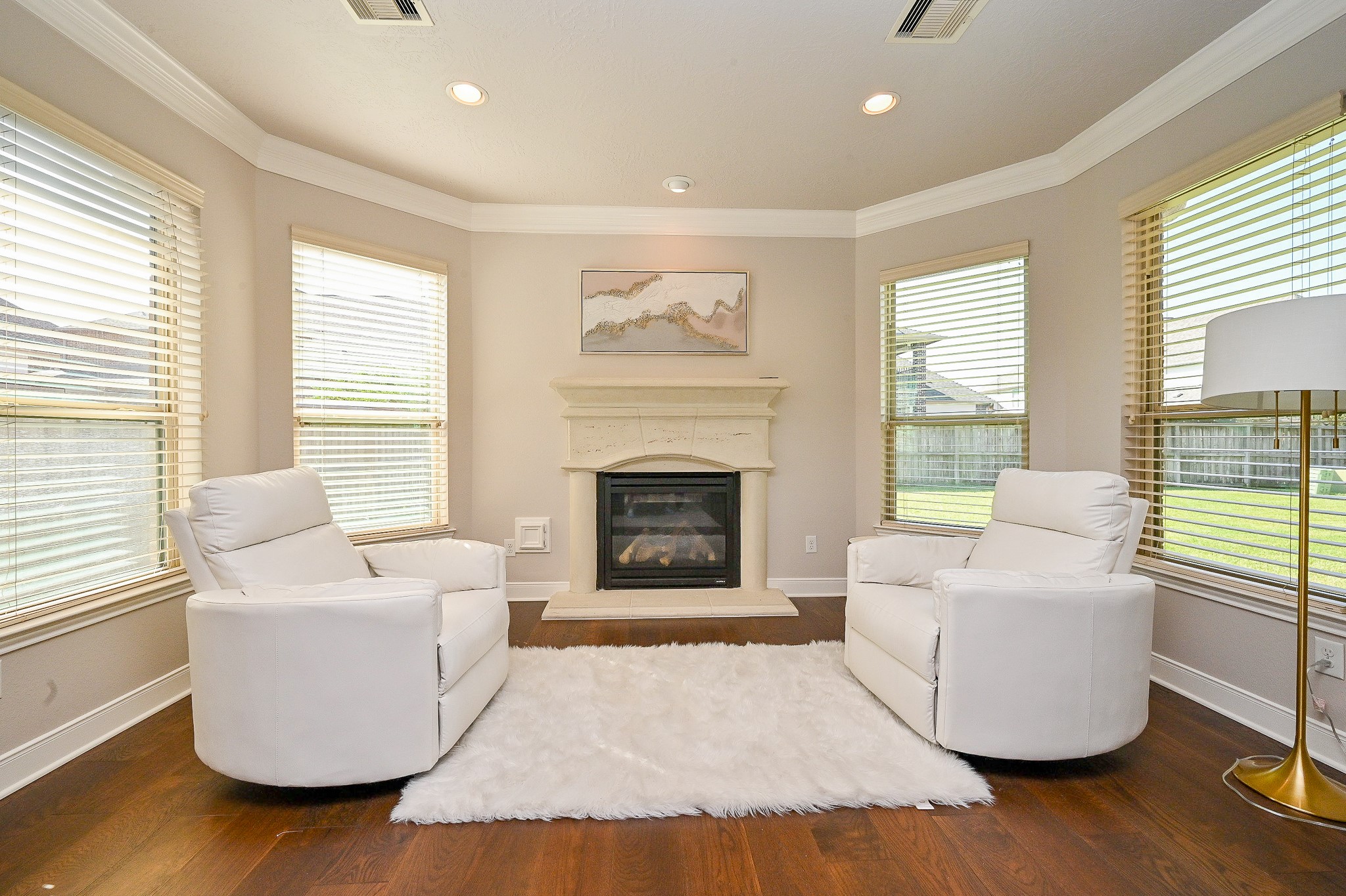 17607 Astrachan Road Richmond, TX 77407 - Photo 24 of 50 a living room with furniture and a fireplace