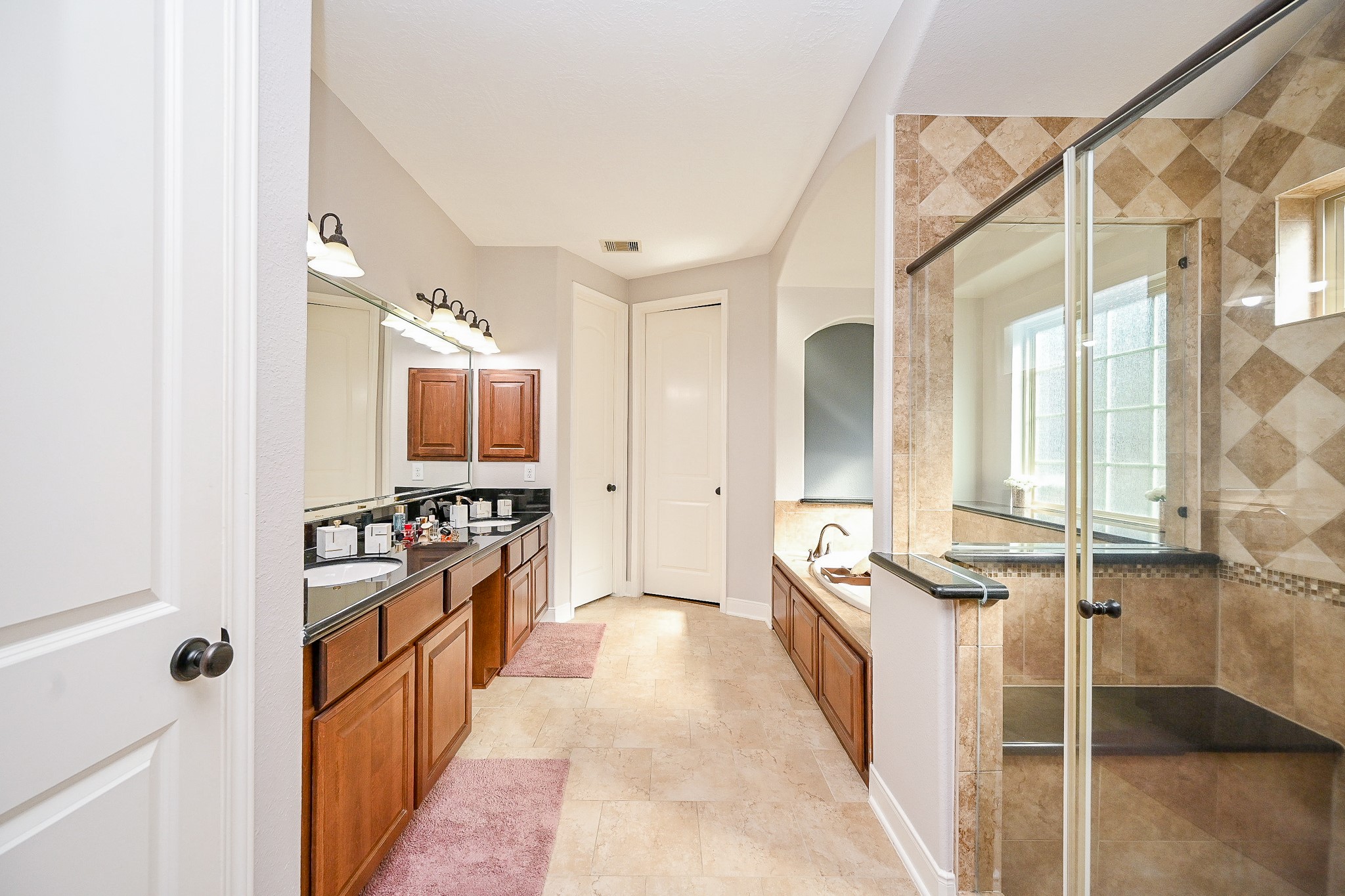 17607 Astrachan Road Richmond, TX 77407 - Photo 25 of 50 a large white kitchen with stainless steel appliances a stove and a refrigerator