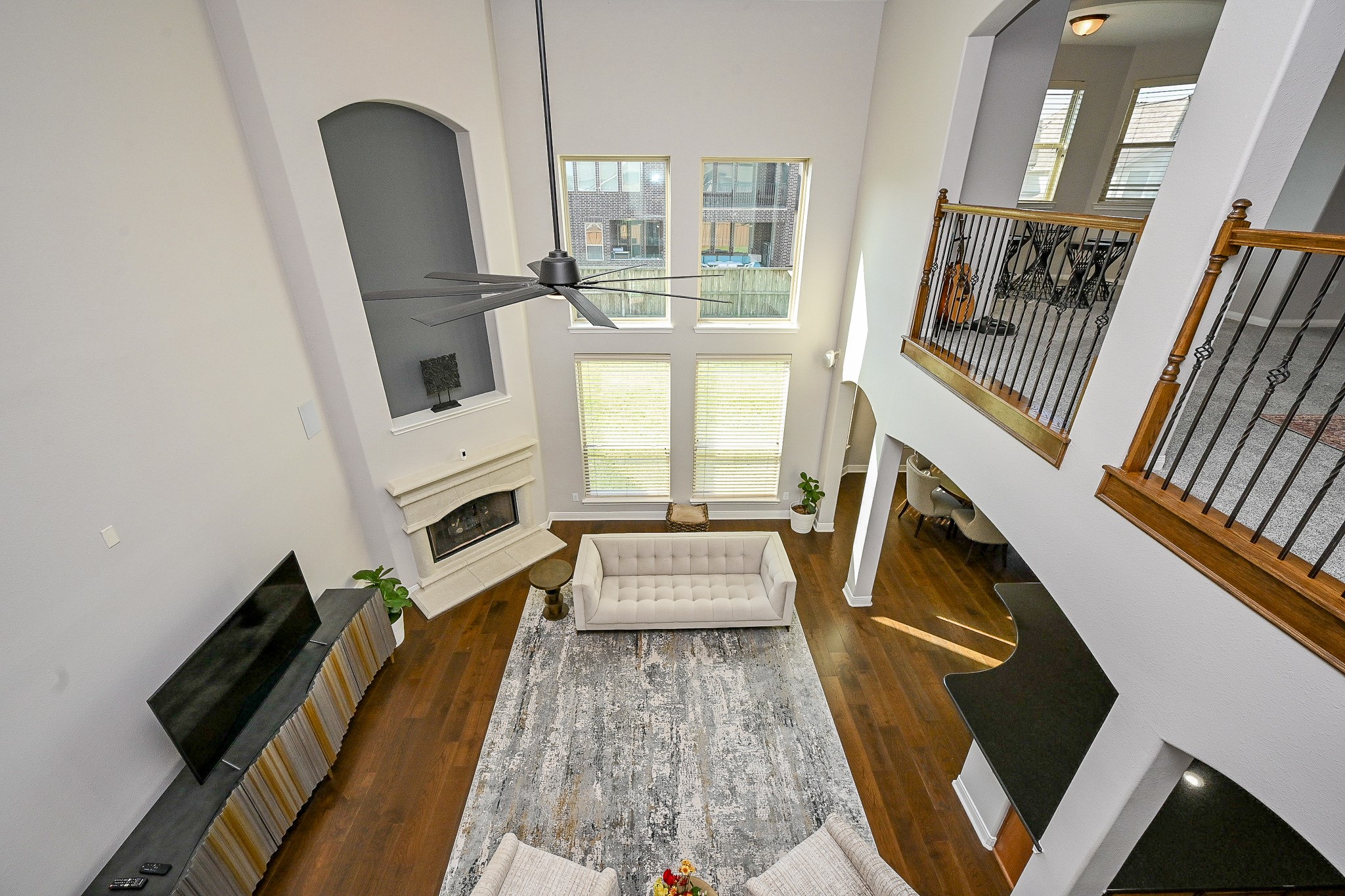 17607 Astrachan Road Richmond, TX 77407 - Photo 30 of 50 a living room with furniture and a fireplace