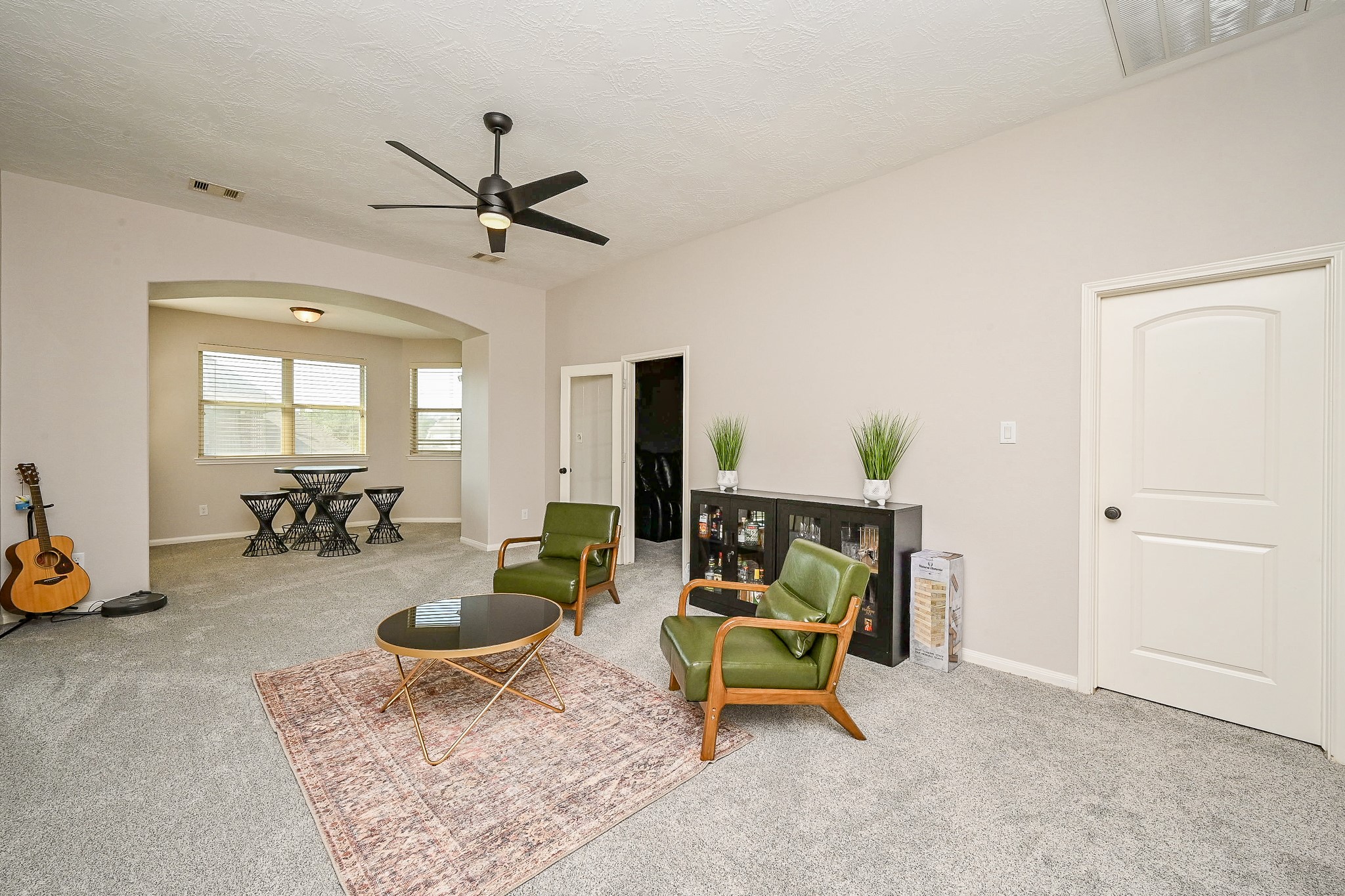 17607 Astrachan Road Richmond, TX 77407 - Photo 31 of 50 a living room with furniture and a chandelier