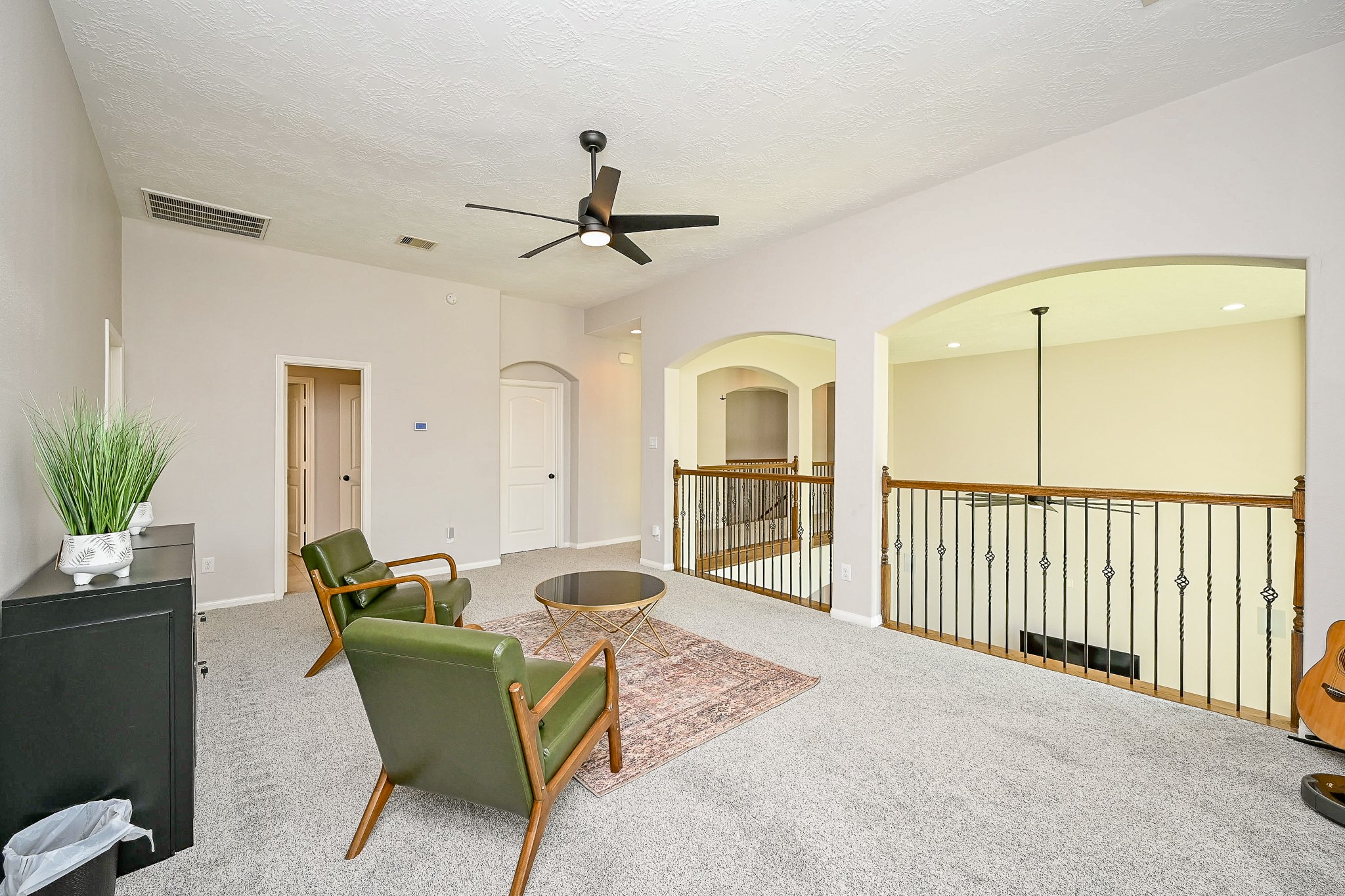 17607 Astrachan Road Richmond, TX 77407 - Photo 32 of 50 a living room with furniture a chandelier and a rug
