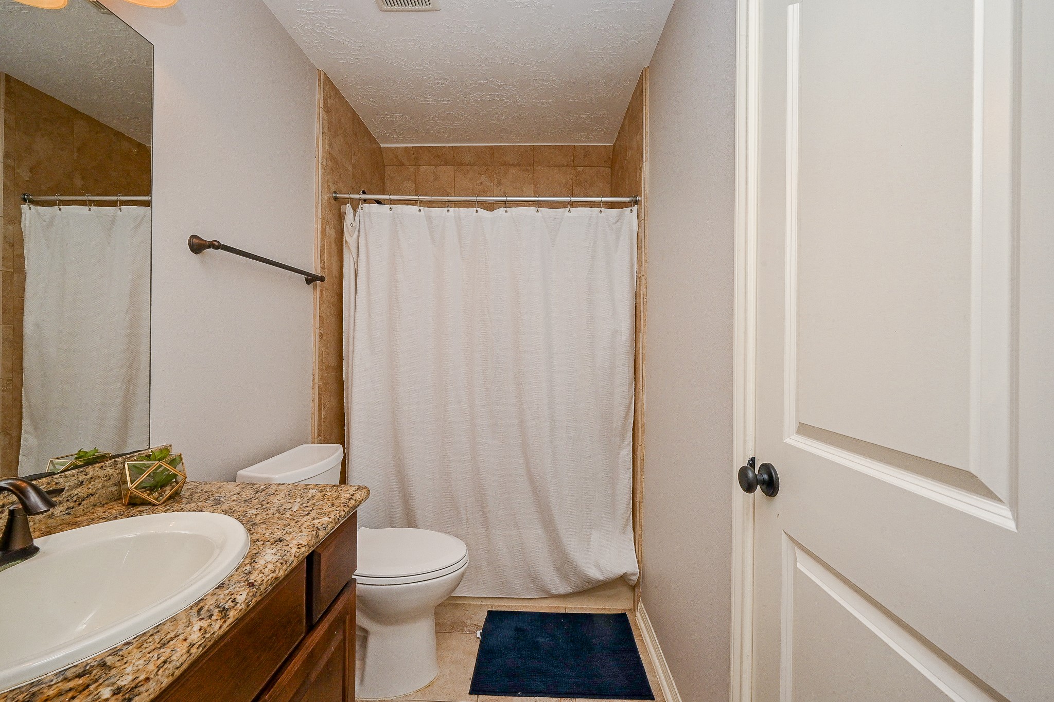 17607 Astrachan Road Richmond, TX 77407 - Photo 40 of 50 a bathroom with a sink toilet and shower