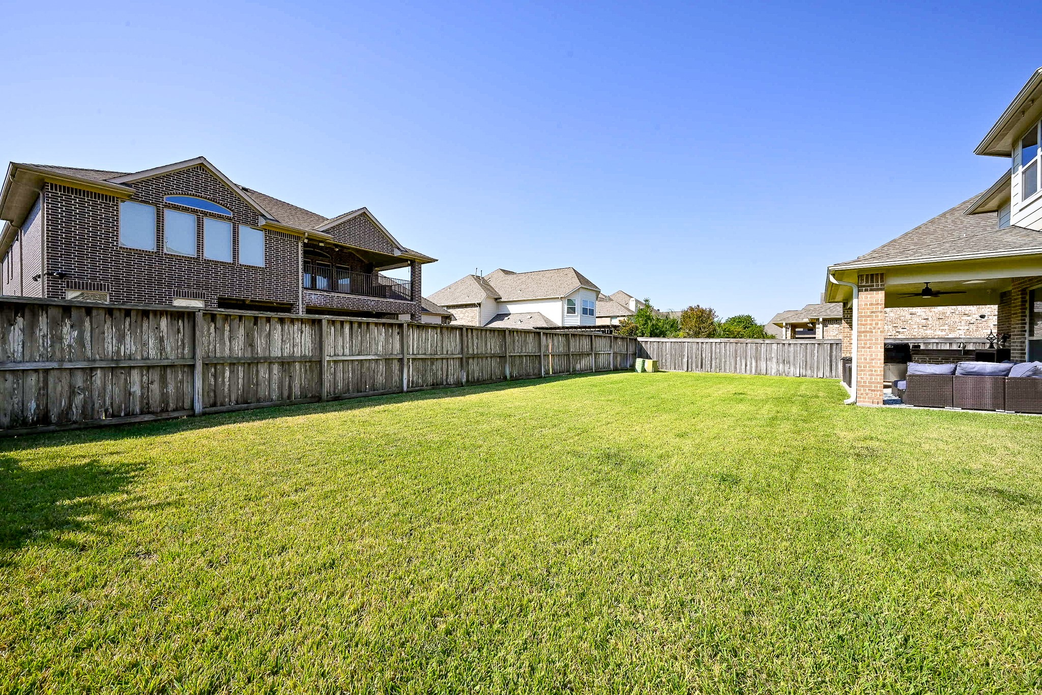 17607 Astrachan Road Richmond, TX 77407 - Photo 44 of 50 a view of a backyard with a garden and entertaining space