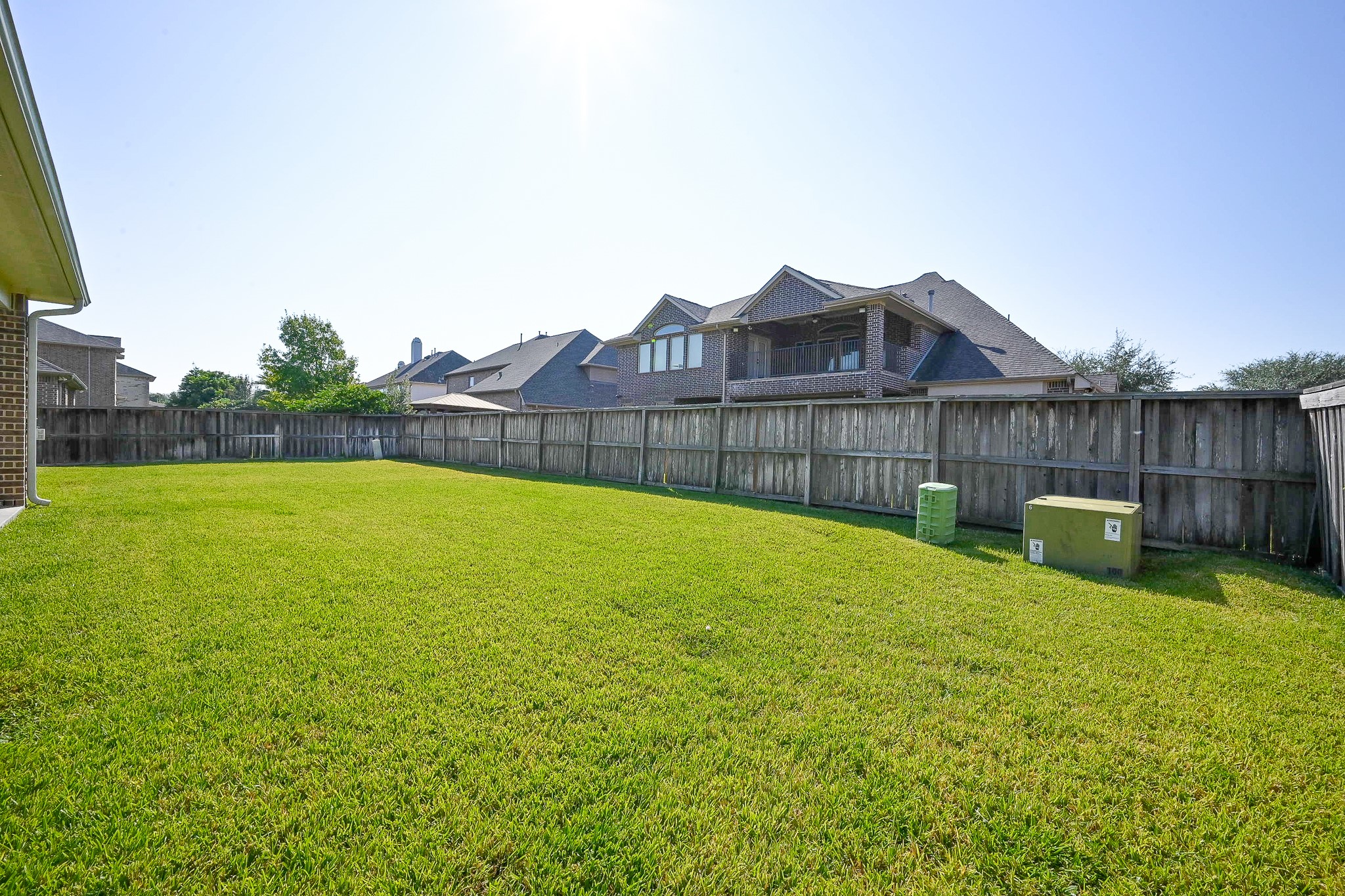 17607 Astrachan Road Richmond, TX 77407 - Photo 45 of 50 a view of a backyard with a small pool and wooden fence