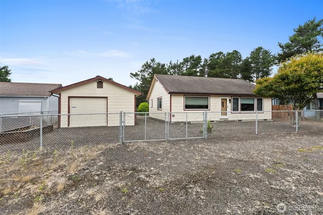 a house with trees in the background