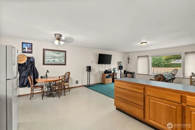 a living room with furniture and flat screen tv