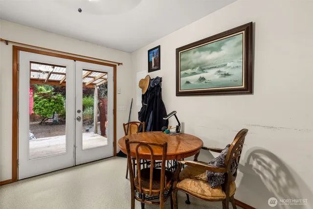 a view of a dining room with furniture wooden floor and a window