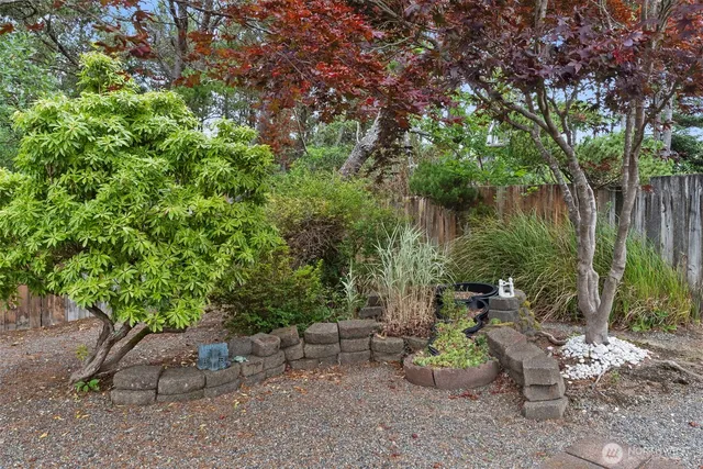 a backyard of a house with a yard and outdoor seating