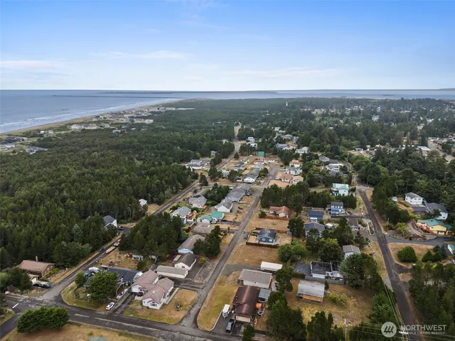 an aerial view of residential building with green space