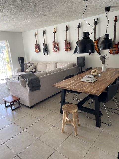 17911 Northwest 68th Avenue, Unit P102 Hialeah, FL 33015 - Photo 1 of 9 a living room with furniture and a table