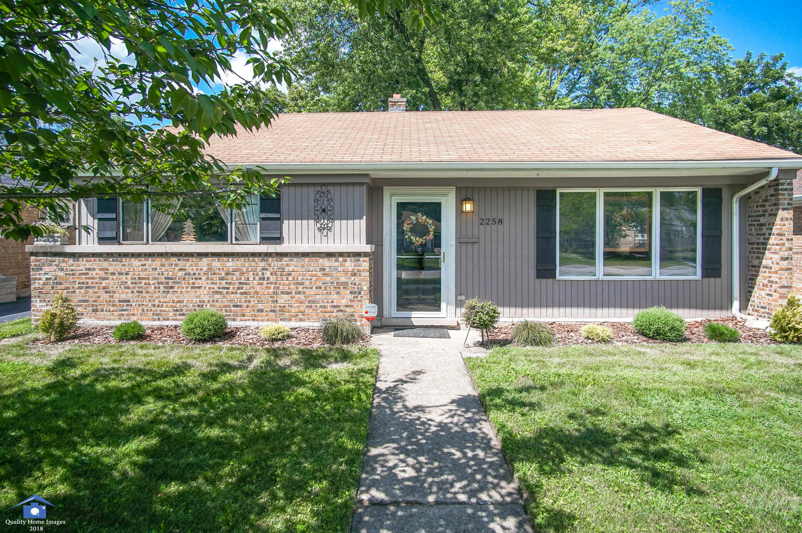 2258 Spruce Road Homewood, IL 60430 - Photo 1 of 19 a front view of a house with garden
