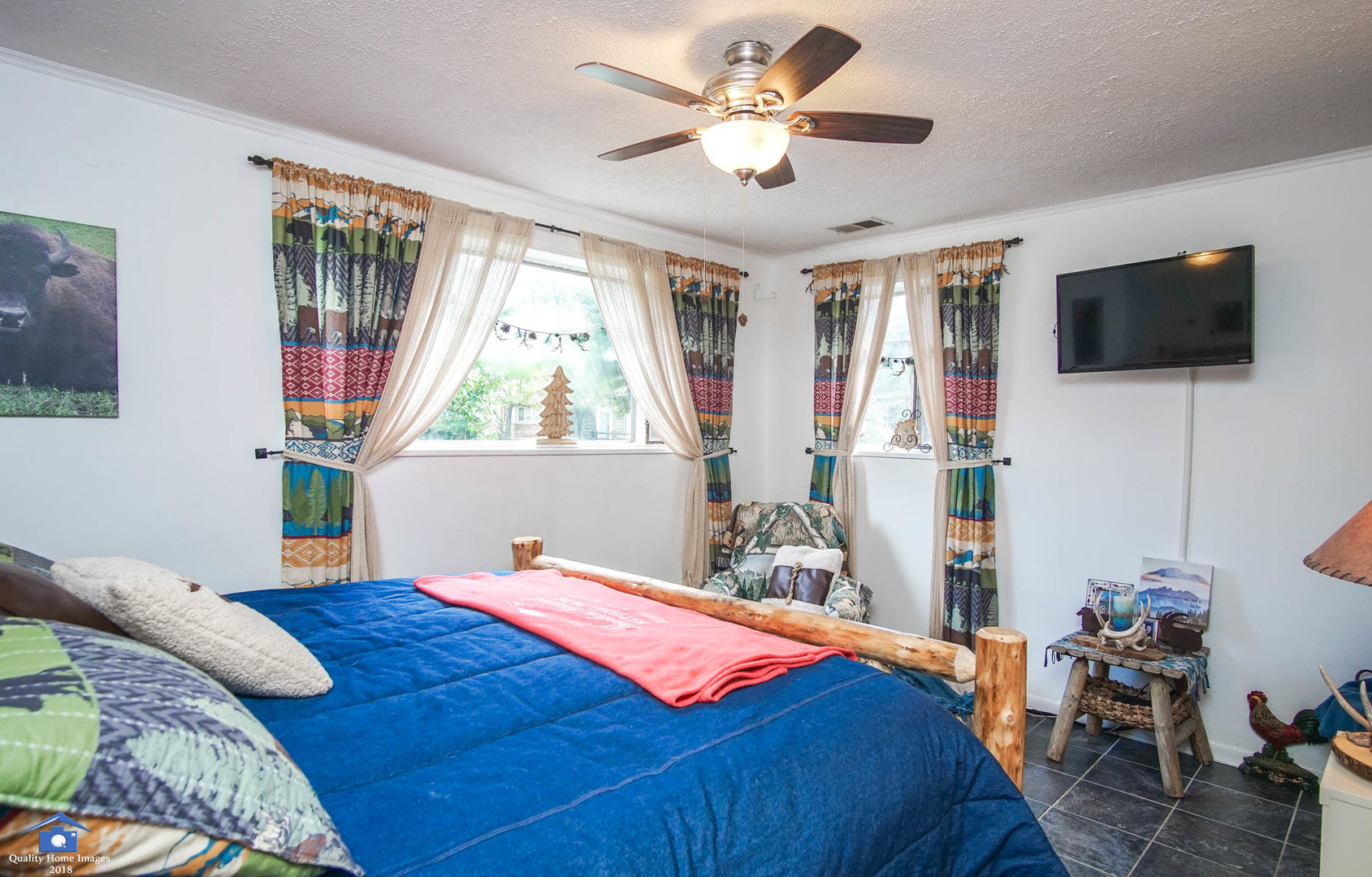 2258 Spruce Road Homewood, IL 60430 - Photo 12 of 19 a bedroom with a bed a window and a flat screen television