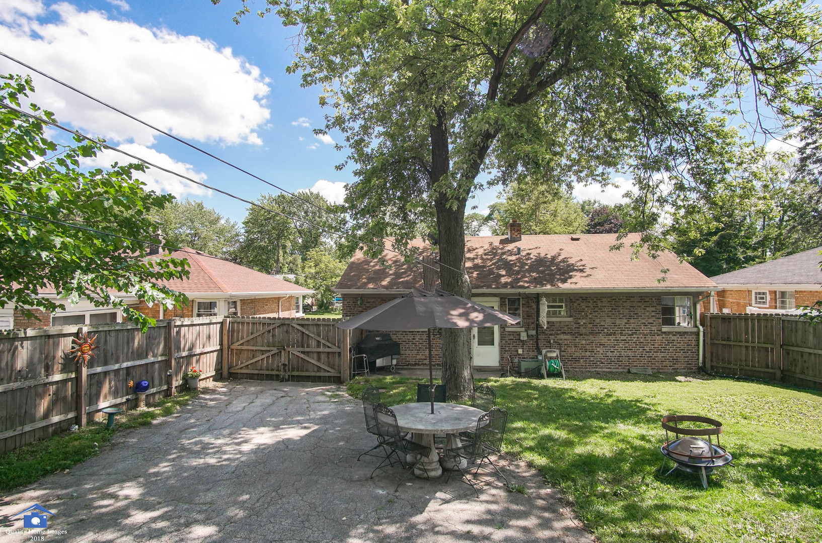 2258 Spruce Road Homewood, IL 60430 - Photo 16 of 19 a view of a chair and table in backyard