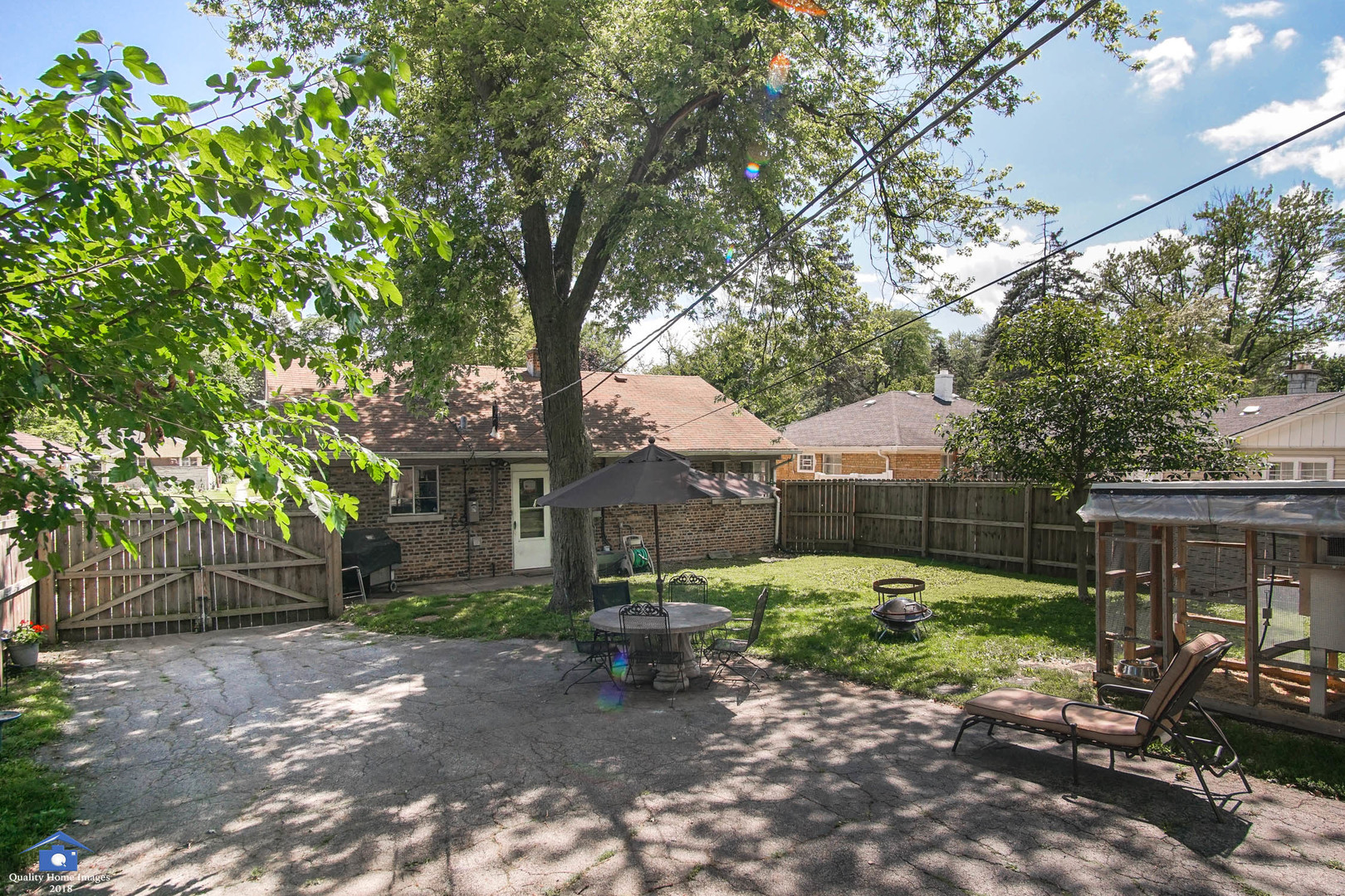 2258 Spruce Road Homewood, IL 60430 - Photo 17 of 19 a view of a chair and table in backyard