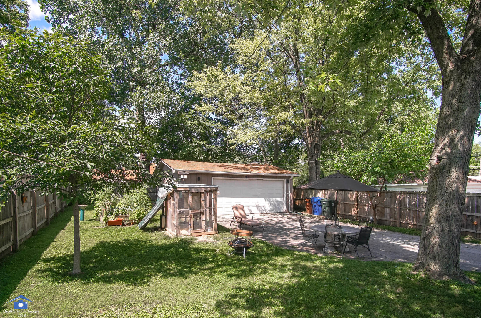 2258 Spruce Road Homewood, IL 60430 - Photo 18 of 19 a view of a house with backyard sitting area and garden