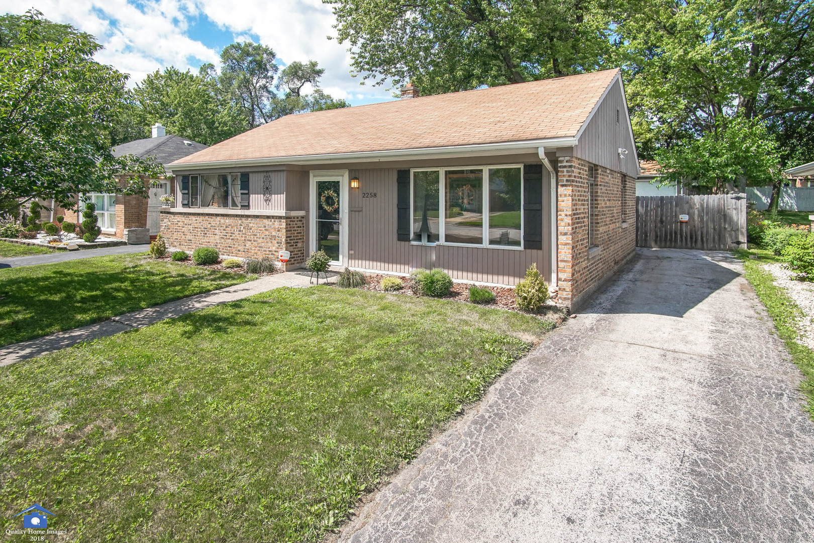 2258 Spruce Road Homewood, IL 60430 - Photo 3 of 19 a front view of a house with a yard