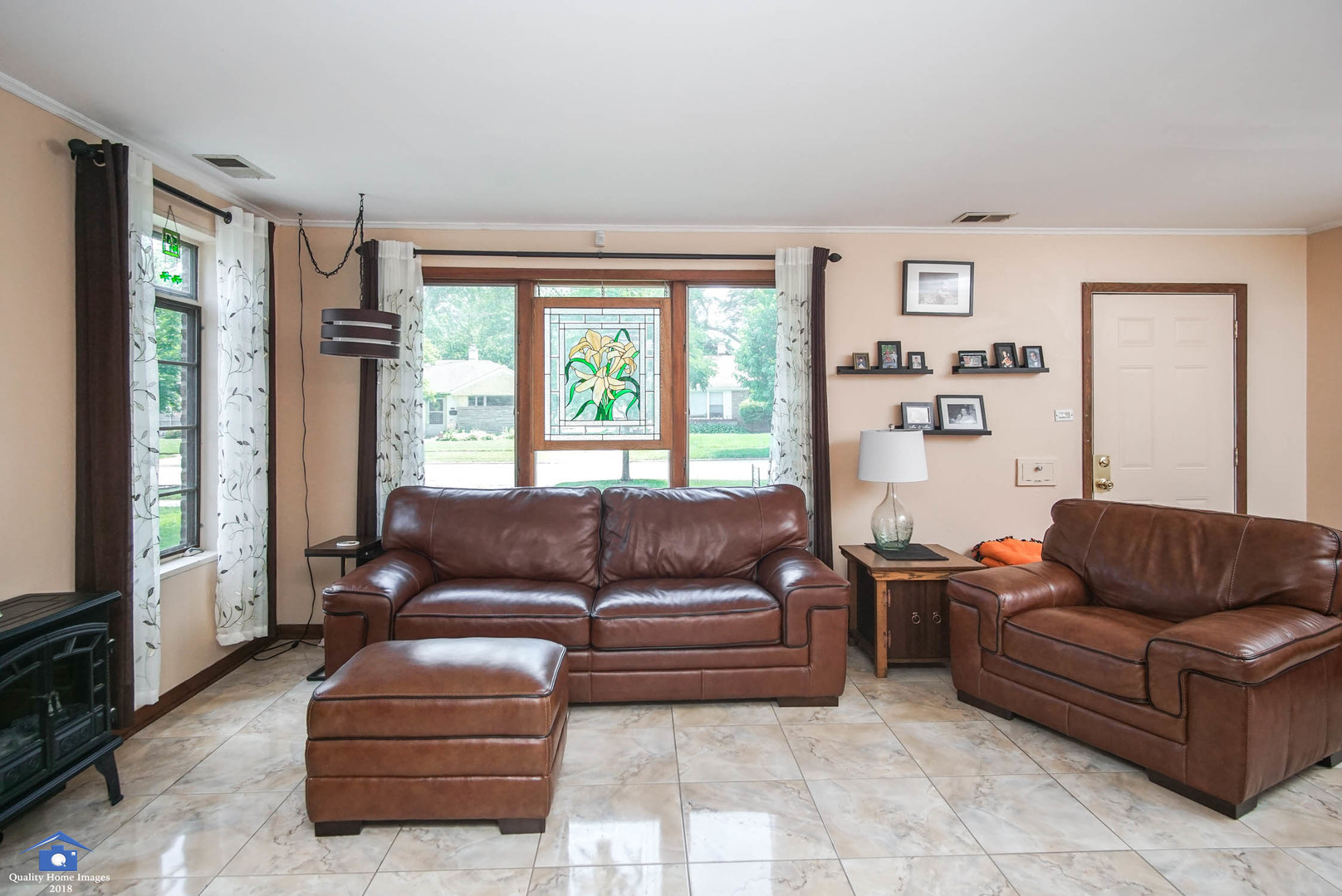 2258 Spruce Road Homewood, IL 60430 - Photo 5 of 19 a living room with furniture and a flat screen tv