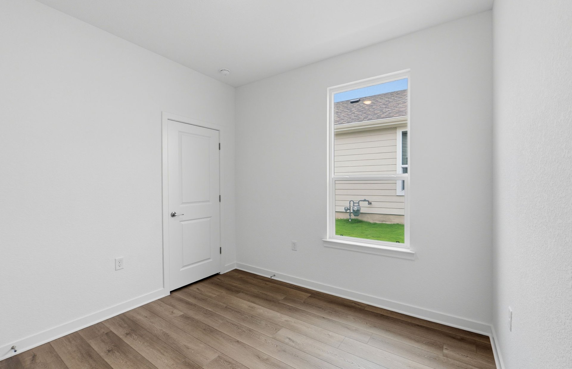 1010 Martingale Street Georgetown, TX 78633 - Photo 16 of 23 a view of an empty room with a window and a dresser