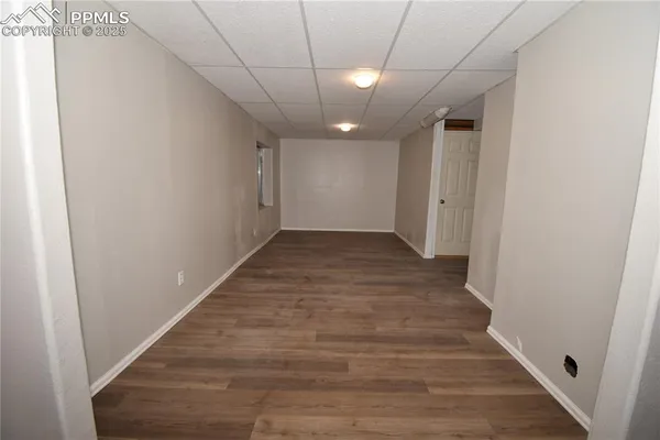 a view of hallway with wooden floor