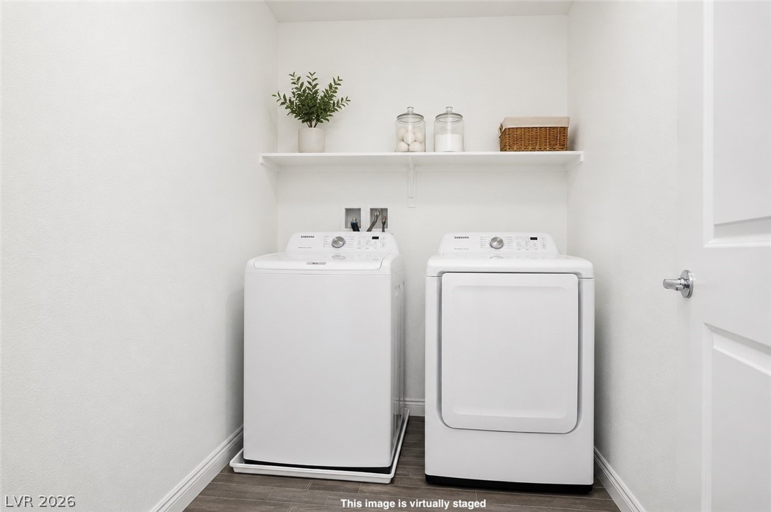 12369 Golden Wreath Road, Unit 2 Las Vegas, NV 89183 - Photo 15 of 19 A well-organized laundry area offers a practical and clean space for household tasks.