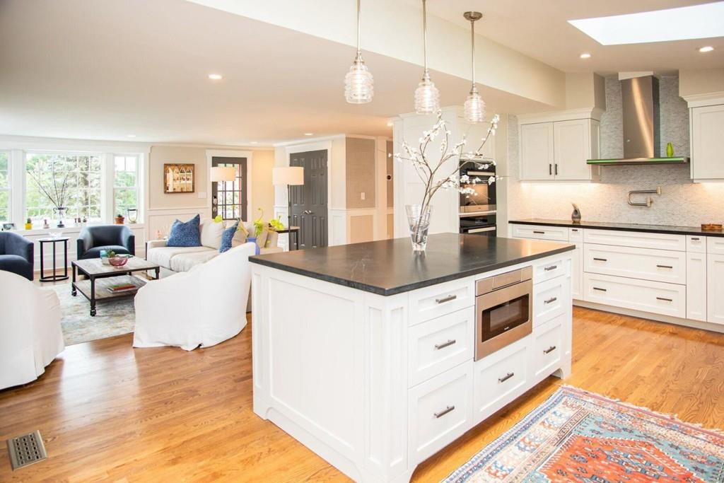 14 Hillsea Road Yarmouth, MA 02675 - Photo 13 of 42 a large kitchen with stainless steel appliances granite countertop a stove and white cabinets with wooden floor