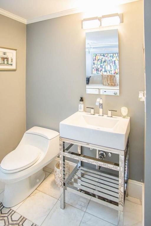 14 Hillsea Road Yarmouth, MA 02675 - Photo 22 of 42 a bathroom with a sink a toilet and a mirror