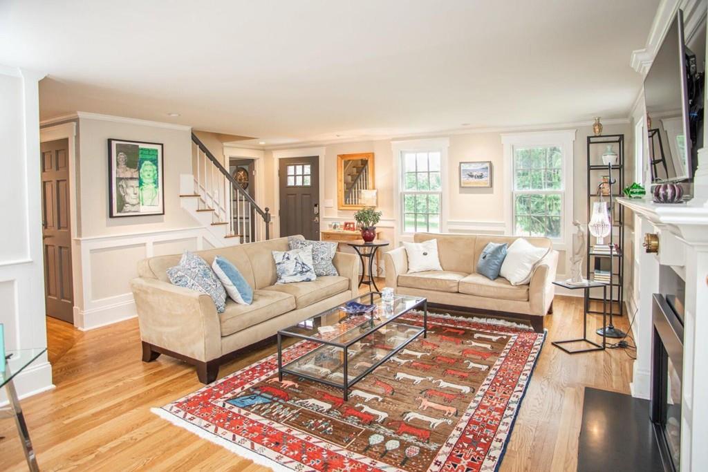 14 Hillsea Road Yarmouth, MA 02675 - Photo 24 of 42 a living room with furniture a fireplace and a table