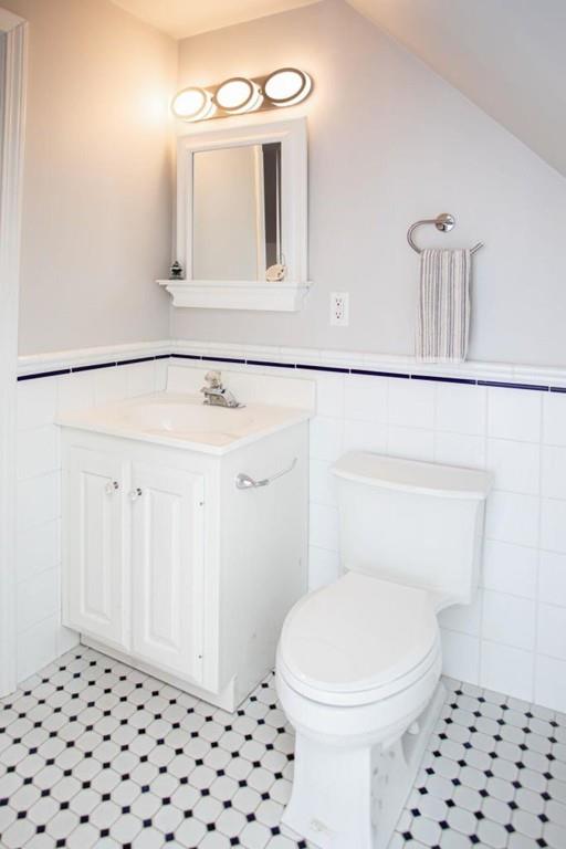 14 Hillsea Road Yarmouth, MA 02675 - Photo 37 of 42 a bathroom with a sink a toilet a mirror and vanity