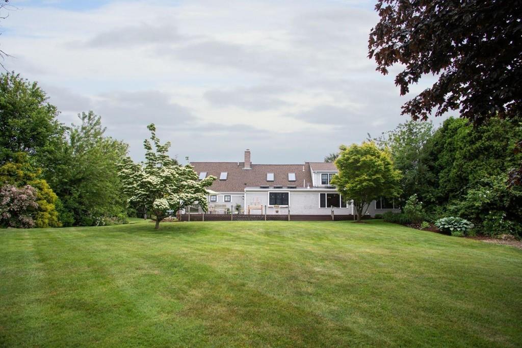 14 Hillsea Road Yarmouth, MA 02675 - Photo 39 of 42 a view of a building with a big yard and large trees