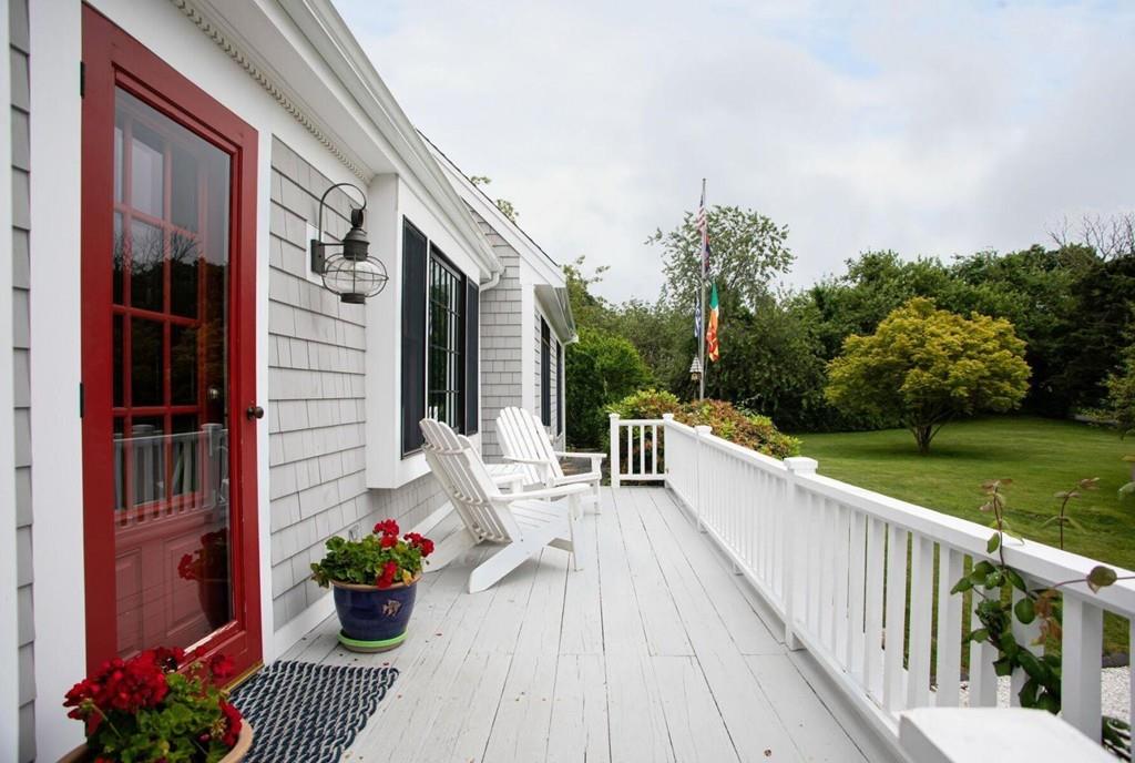 14 Hillsea Road Yarmouth, MA 02675 - Photo 4 of 42 a view of a balcony with wooden floor and seating space