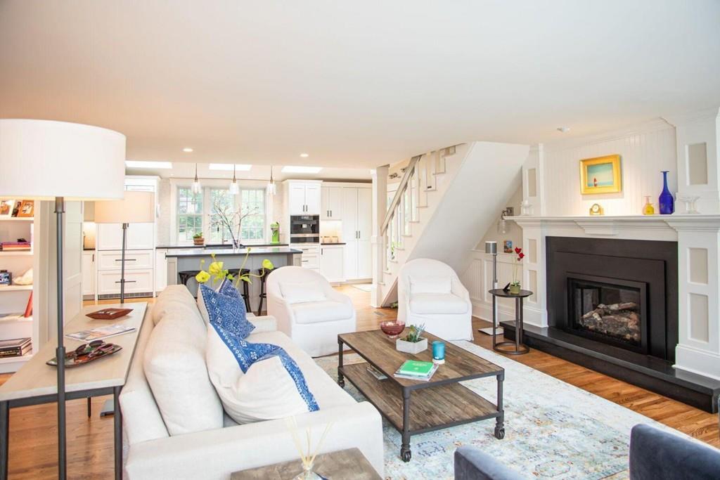 14 Hillsea Road Yarmouth, MA 02675 - Photo 7 of 42 a living room with furniture a fireplace and a table