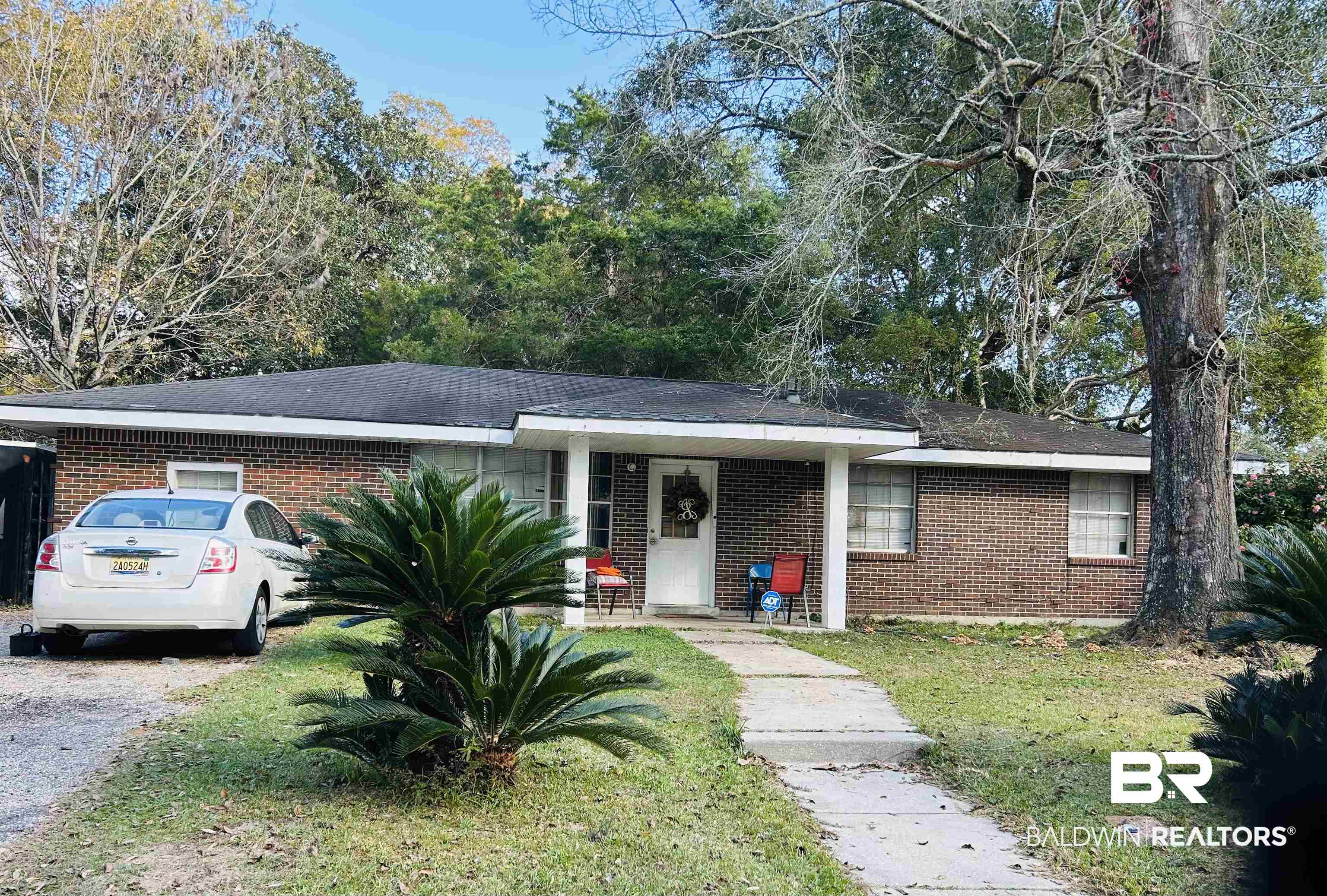 1600 Decatur Street Mobile, AL 36618 - Photo 1 of 5 Single story home featuring a front yard, brick siding, and roof with shingles
