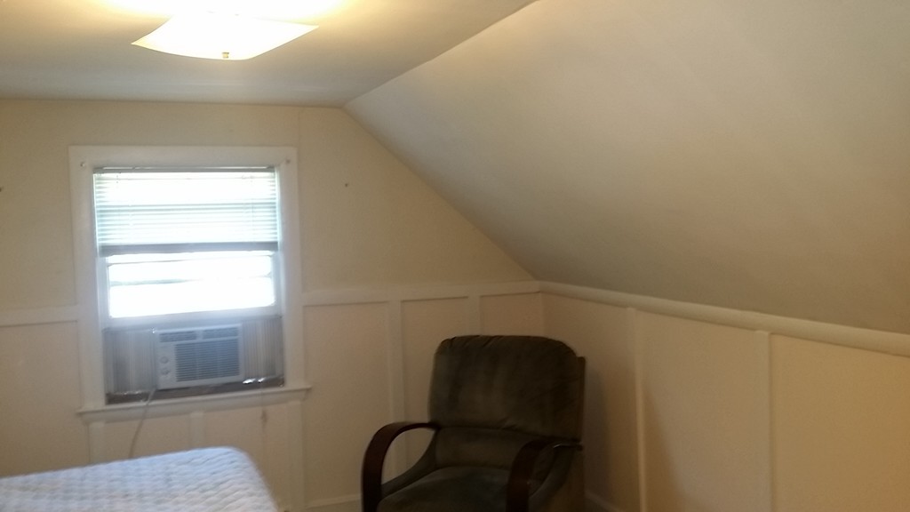 41 Audrea Road Framingham, MA 01701 - Photo 6 of 10 a view of a chair and window